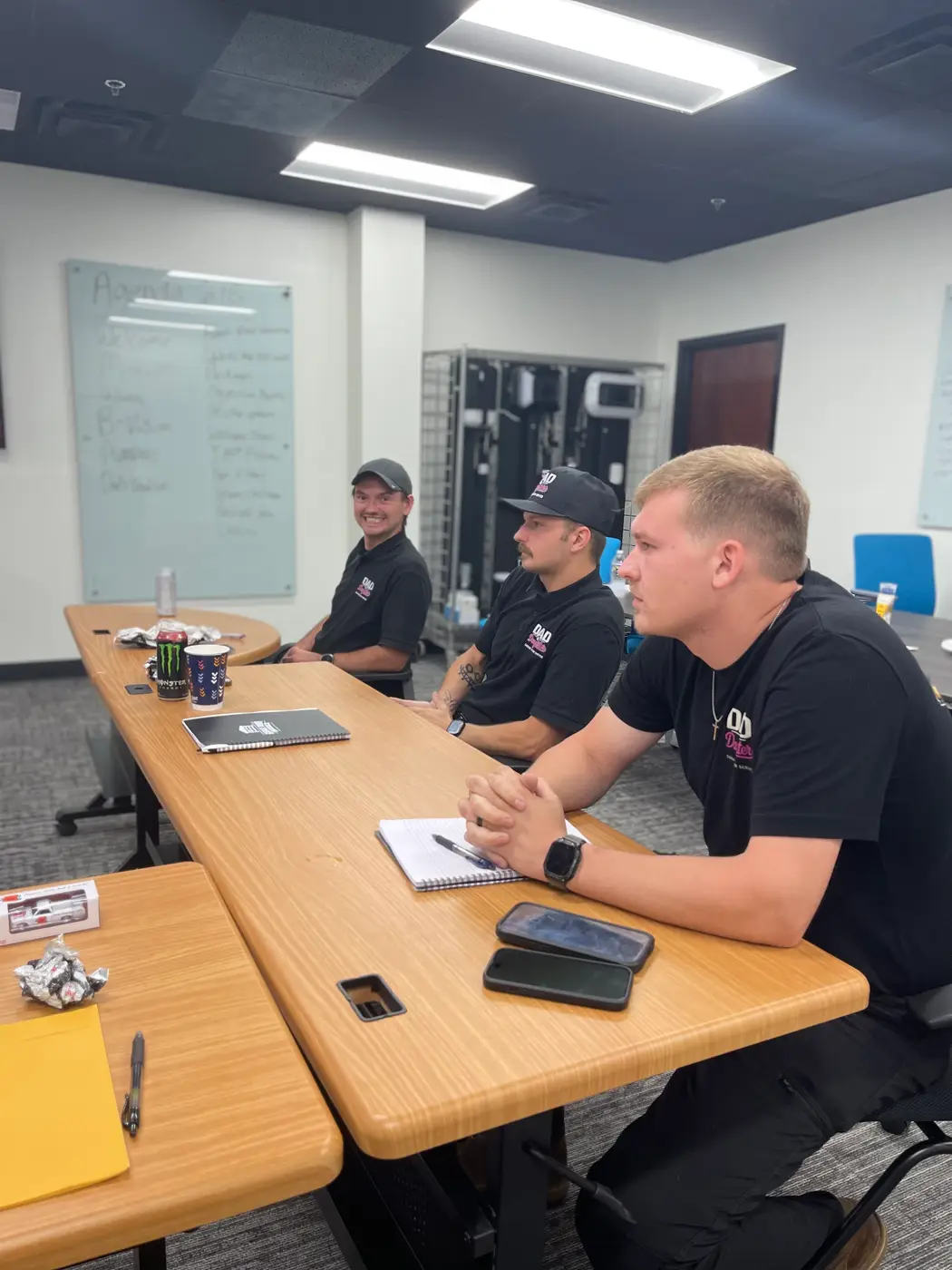 Dad & Daughter technicians during a team training meeting