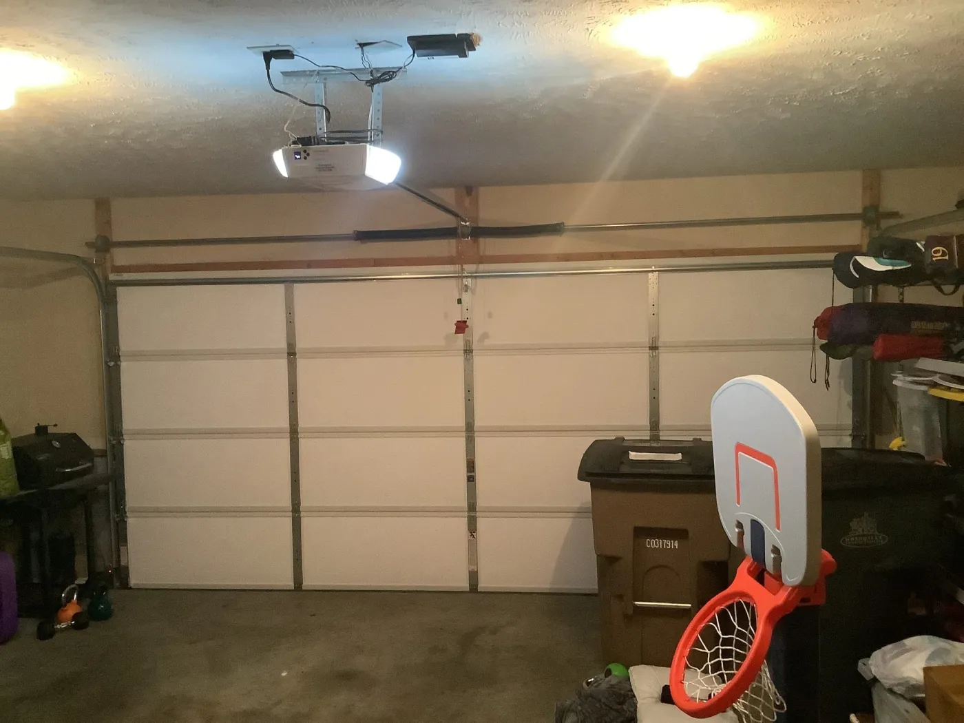 Dad & Daughter garage door project, insulated double garage door interior with dual torsion spring and marantec motor