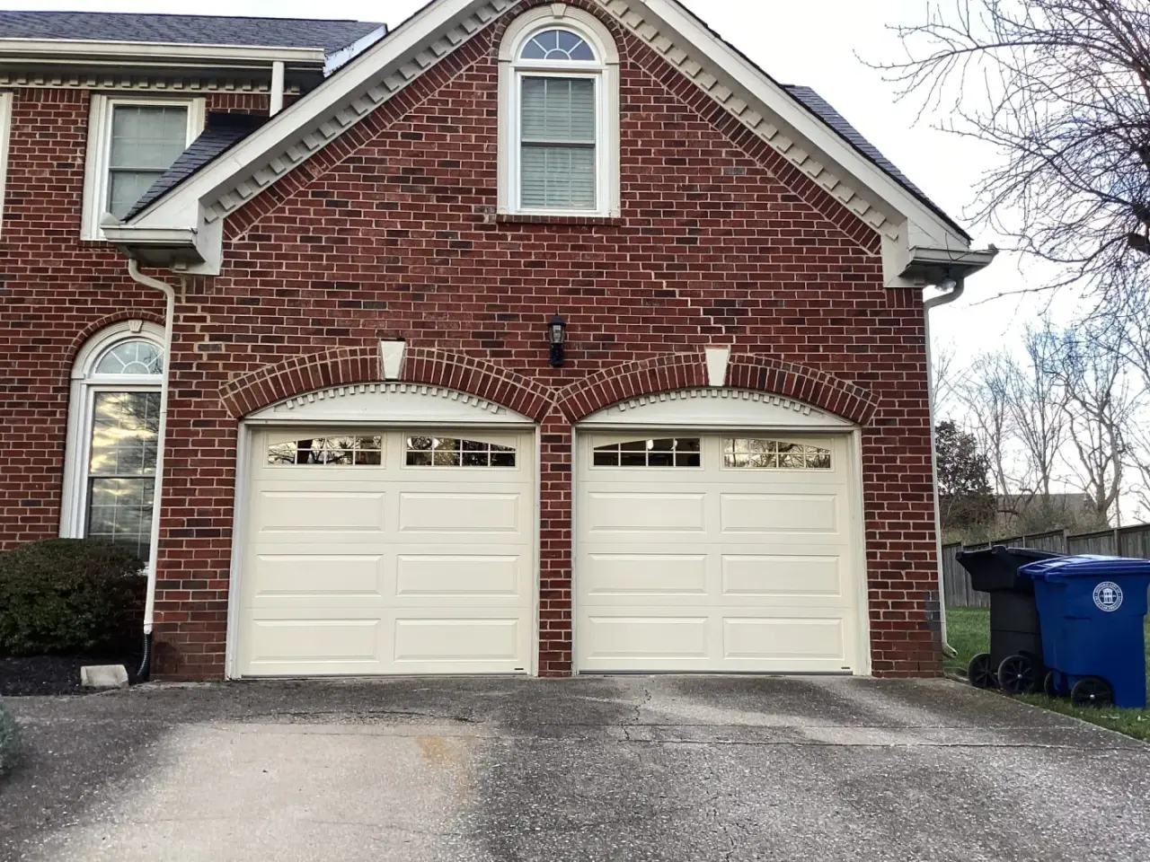 Dad & Daughter garage door project, two 9x7 long raised ranch panel with glass stockton arch almond