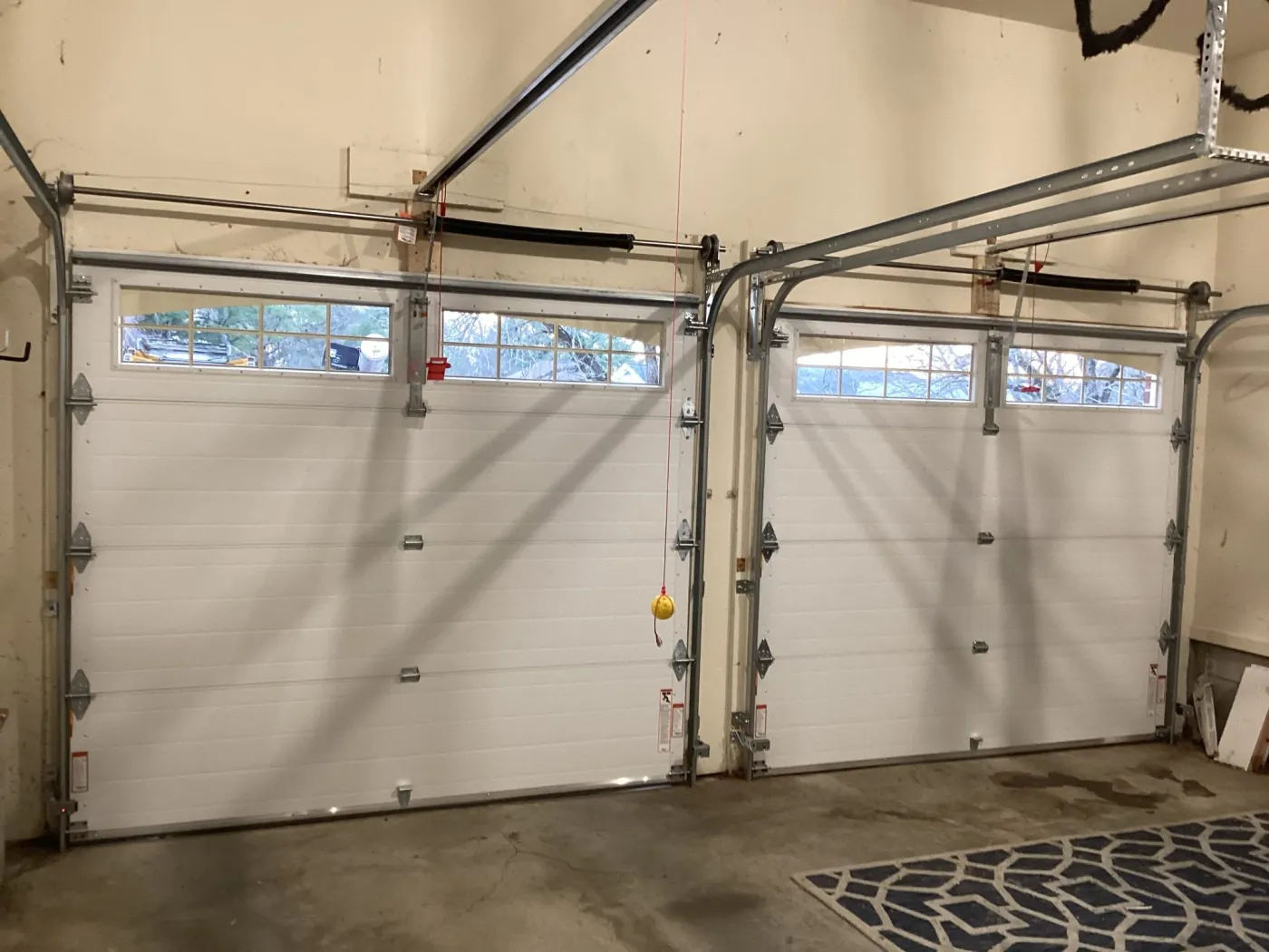Dad & Daughter garage door project, two interior 9x7 steel back insulated garage doors with glass torsion spring