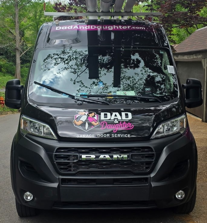 Dad & Daughter branded truck on the road